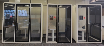 Three small self contained study or meeting rooms. Each have a desk. One is larger and has bench seats on each side of table. Rest is intended for a single person.