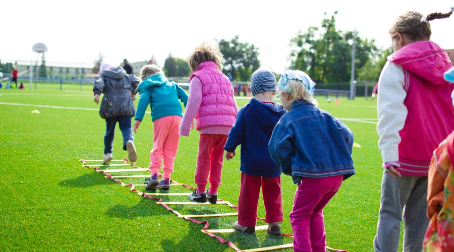 Children playing in a sports field