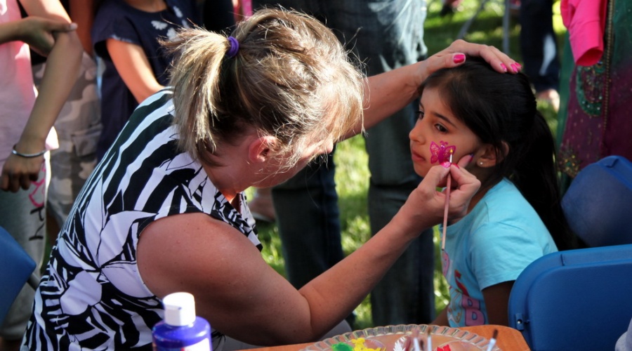Child having her face painted