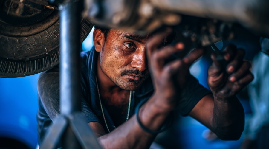 Man working underneath car