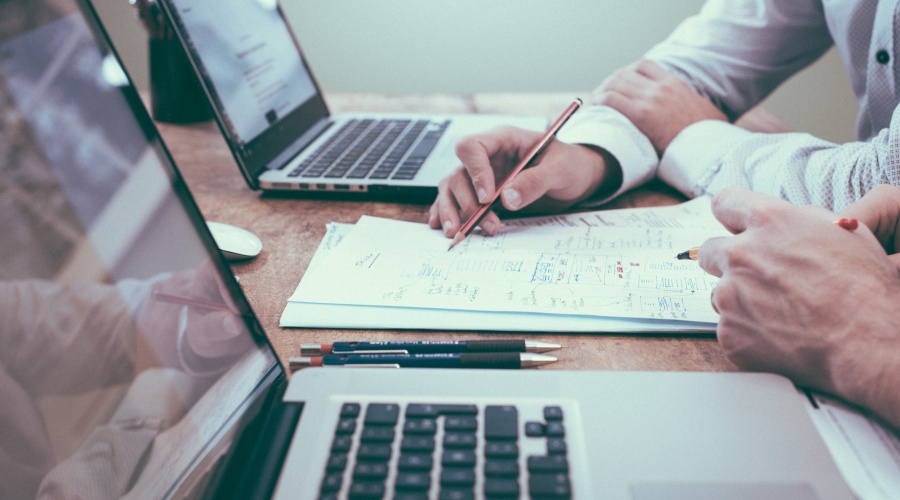Business people working together on notes