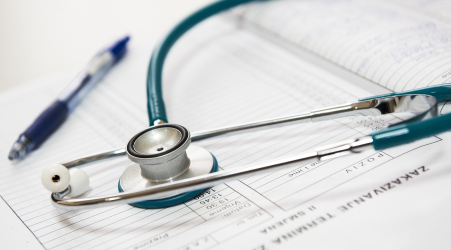 Stethoscope and a chart with a pen