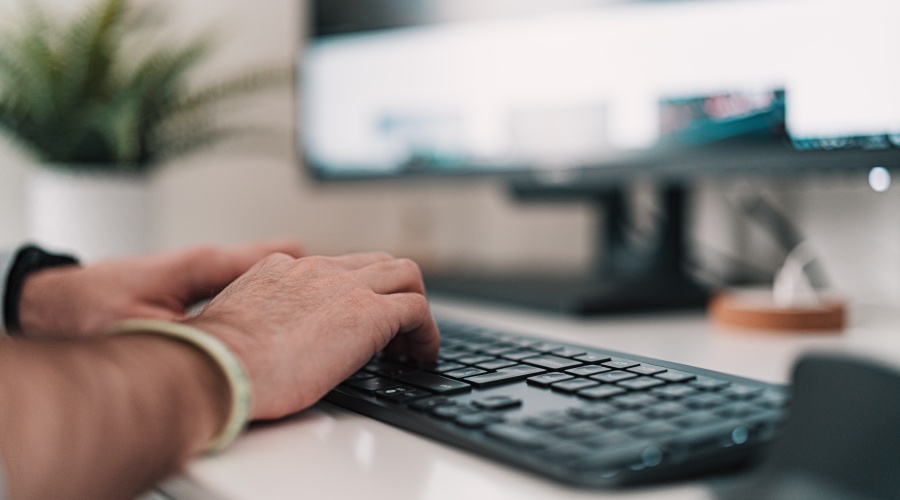 human typing on keyboard