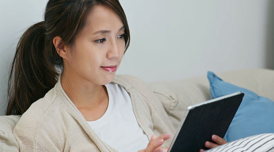 Woman reading on a digital device