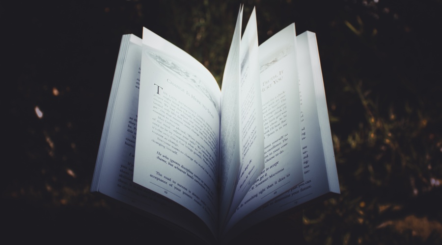 Open book against a dark background