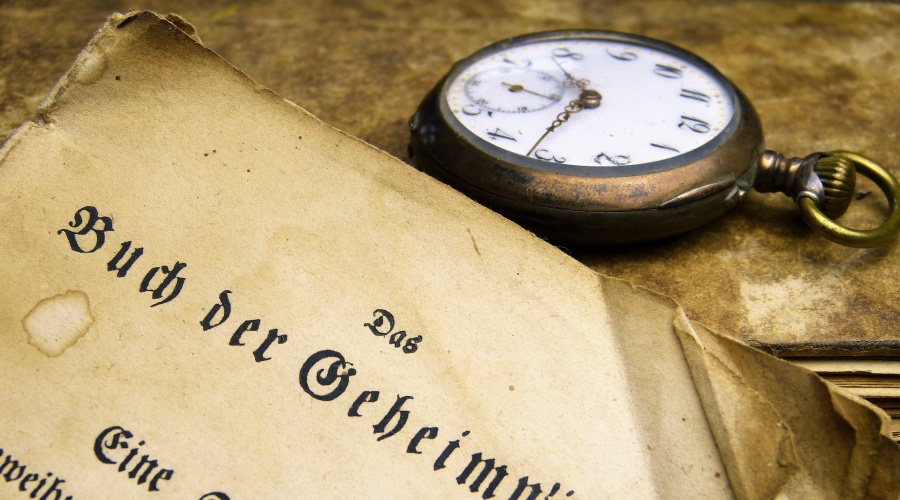 Old book and antique pocket watch