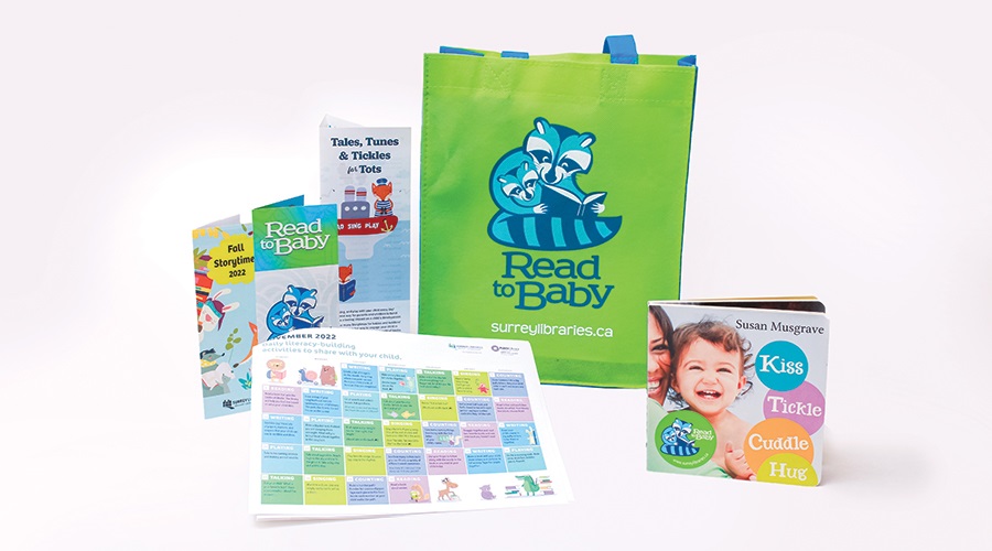 Children's book, literacy materials and a colourful book bag