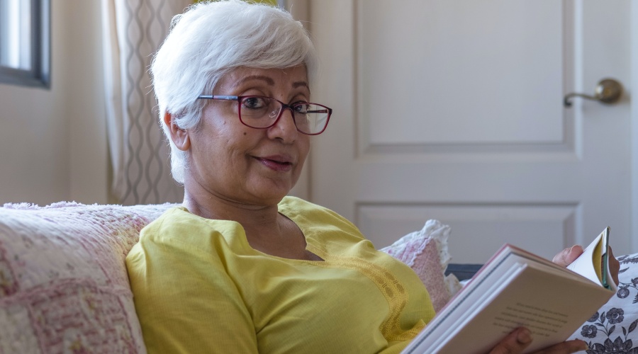 Older woman reading a book