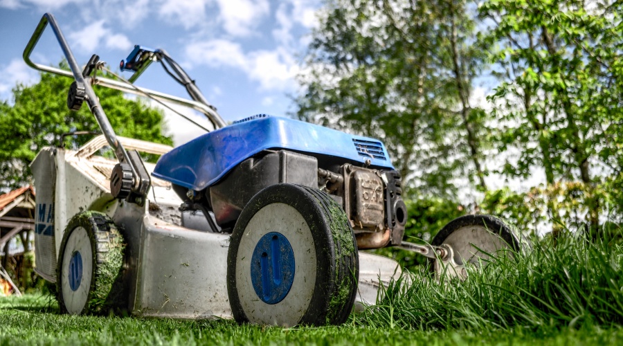 Lawn mower cutting grass