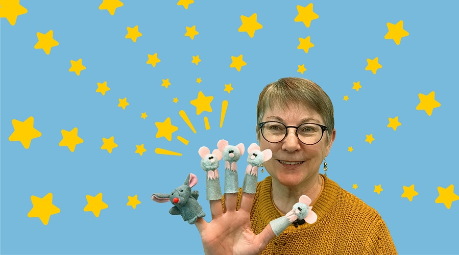 Staff member with mouse finger puppets