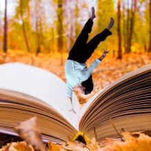 Person falling into a book with an autumn background