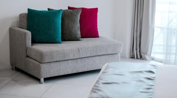 Couch with throw pillows in apartment