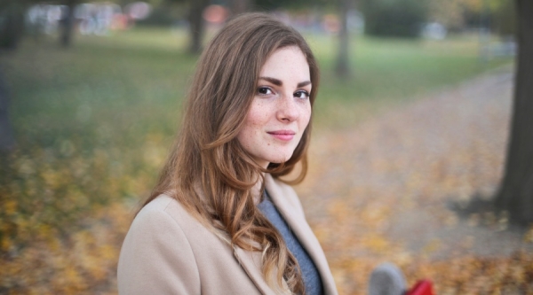 Young woman standing in a park