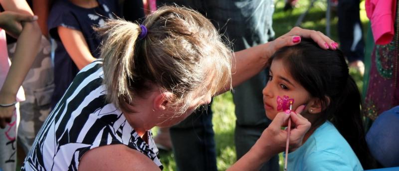 Child having her face painted