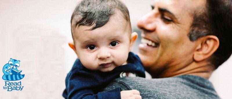 Man holding small toddler